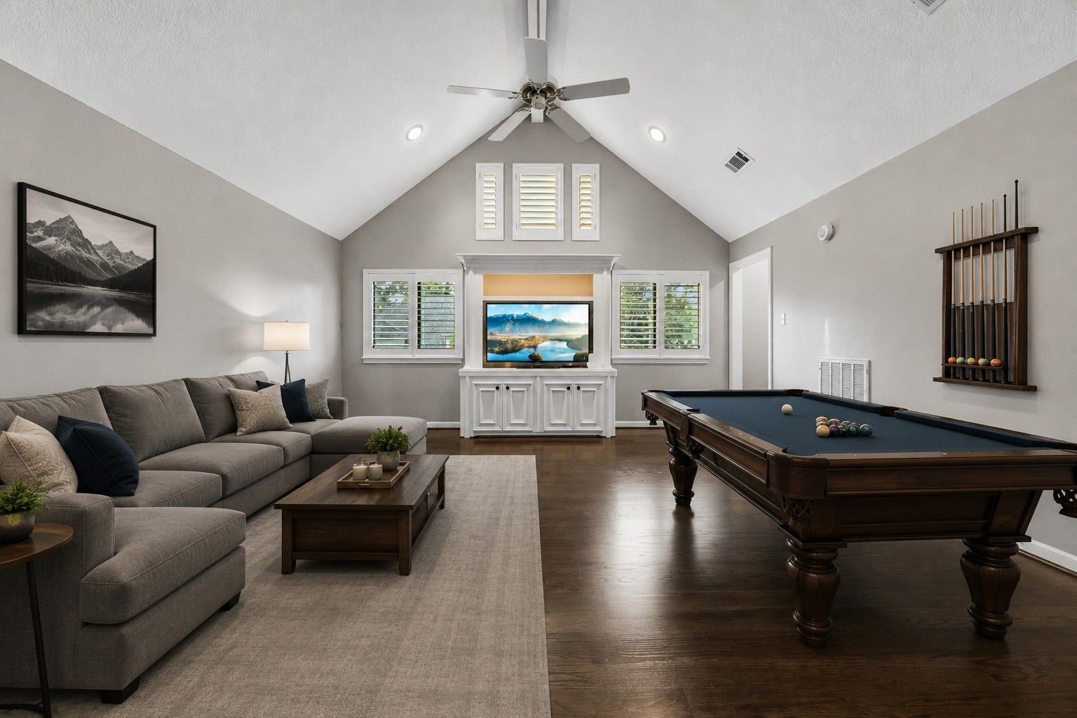 Professionally photographed recreation room with vaulted ceiling